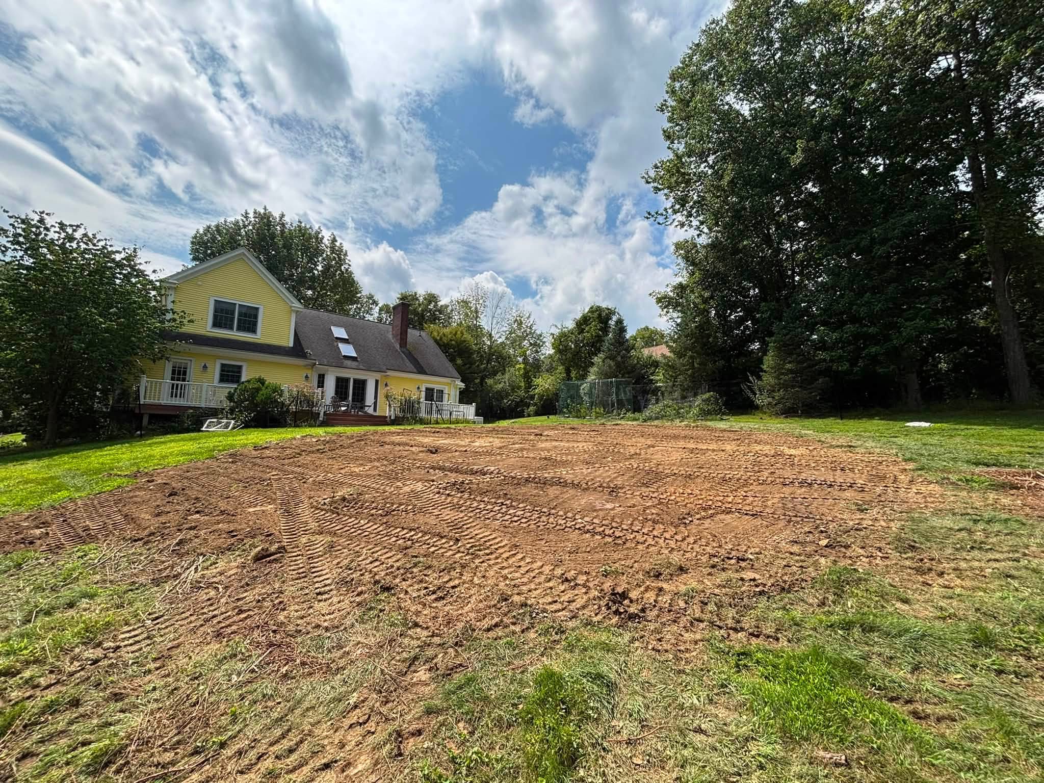 Finished grade where pool base once was — Spencer, MA